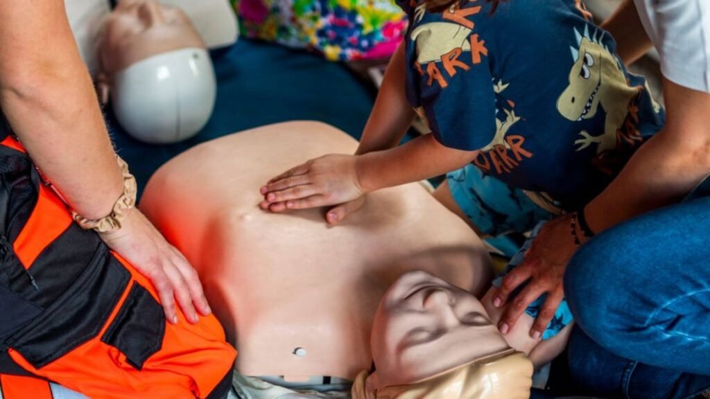 a group training for cpr on a dummy