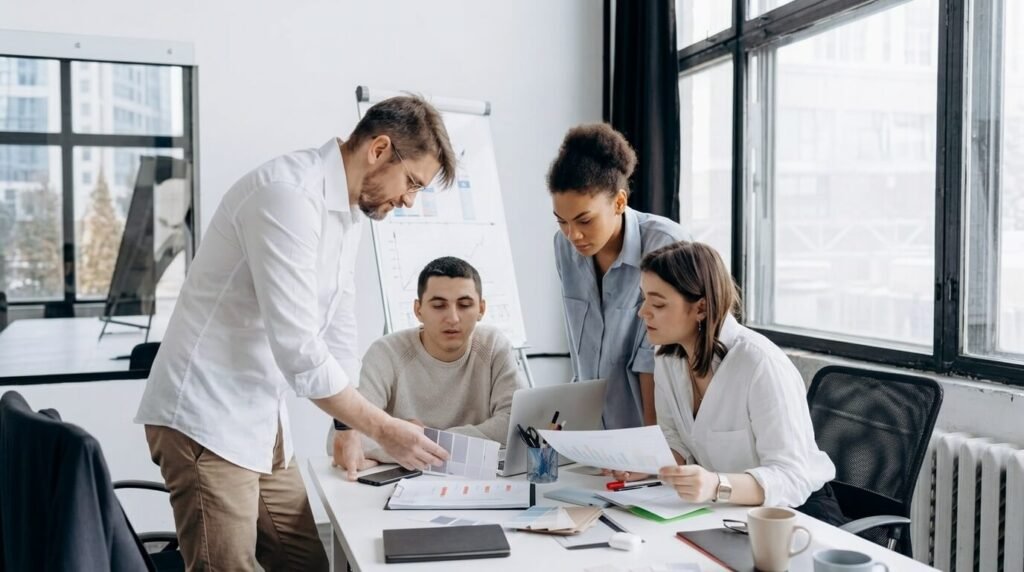 group of people working together at an office