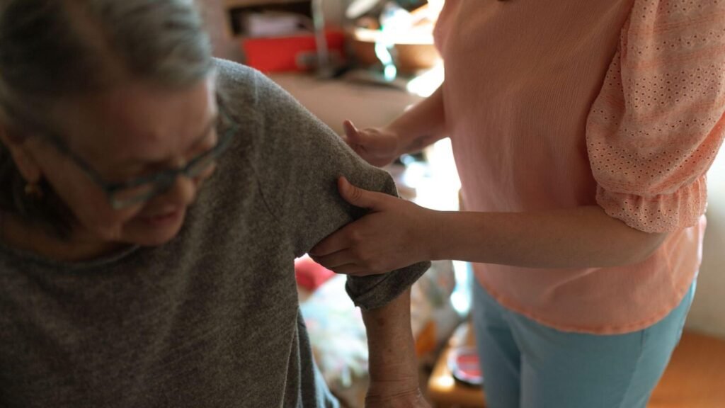 woman holding an elderly woman sturdy