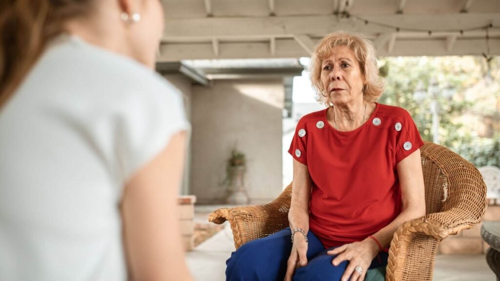 woman talking with elderly woman