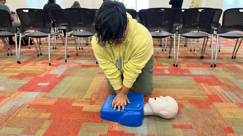 young woman practicing cpr